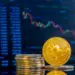 close up of golden bitcoins on a dark reflective