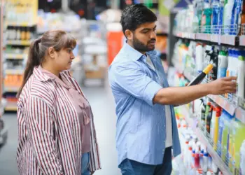 indian couple choosing cleaning products
