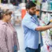 indian couple choosing cleaning products