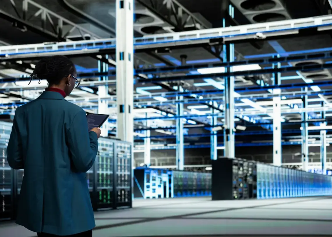 data center computer scientist coding on tablet