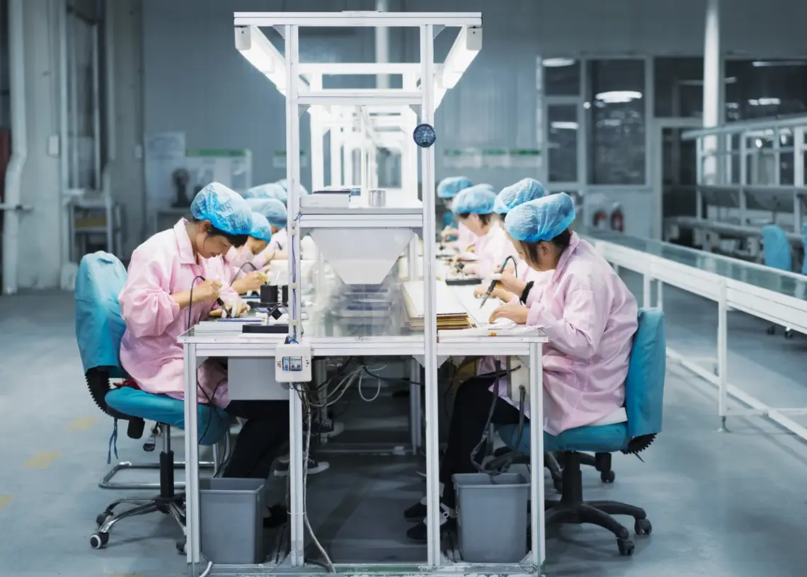 female workers in solar panel assembly factory
