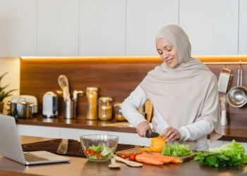 woman in hijab preparing healthy meal