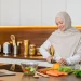 woman in hijab preparing healthy meal