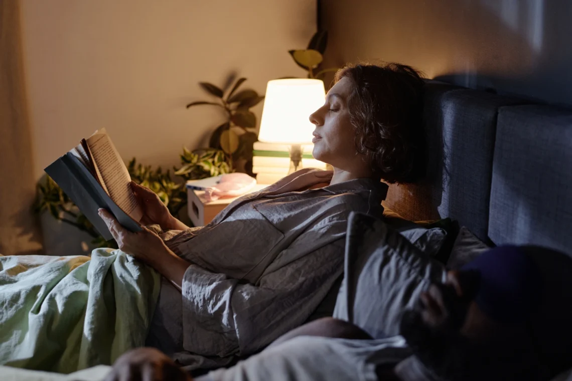 woman reading in bed