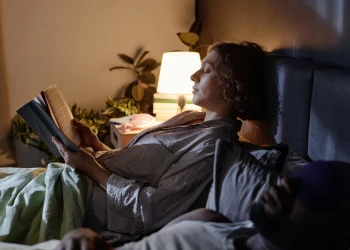 woman reading in bed
