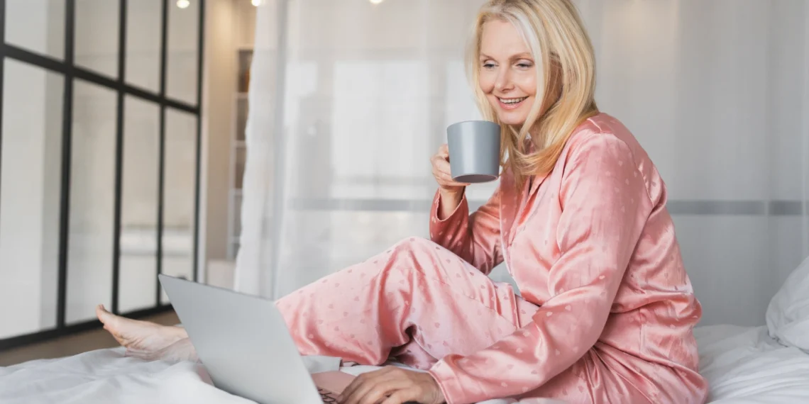 woman relaxing with laptop and coffee
