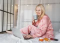 woman relaxing with laptop and coffee