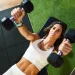 woman training with dumbells