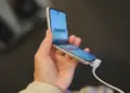 close up of woman holding mobile phone in hands