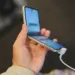 close up of woman holding mobile phone in hands