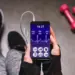 cropped view of woman holding smartphone