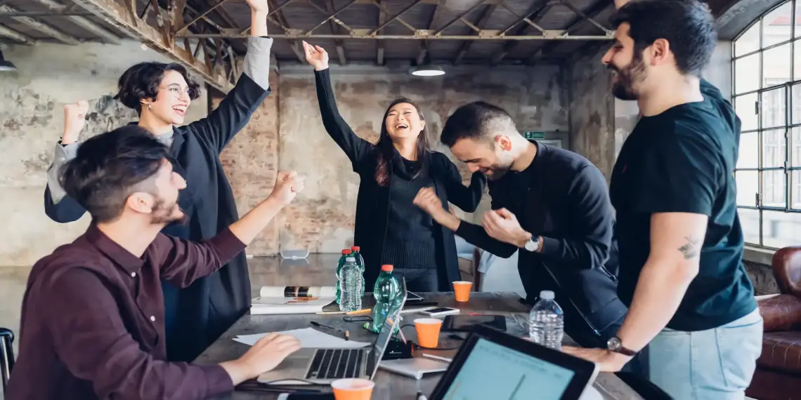 designers celebrating success in studio