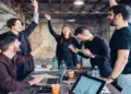 designers celebrating success in studio