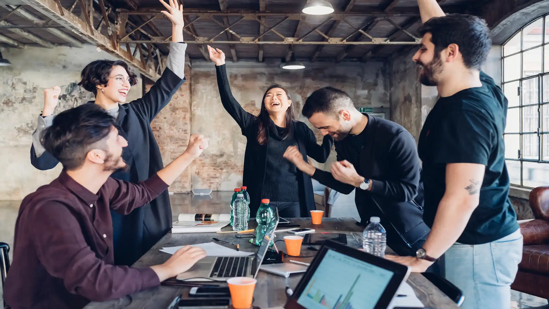designers celebrating success in studio