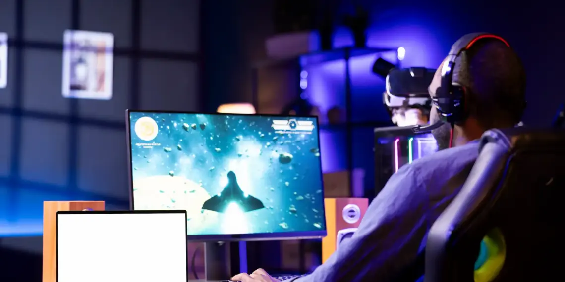 man playing video game wearing headphones at home