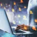side view and close up of hacker hand using laptop