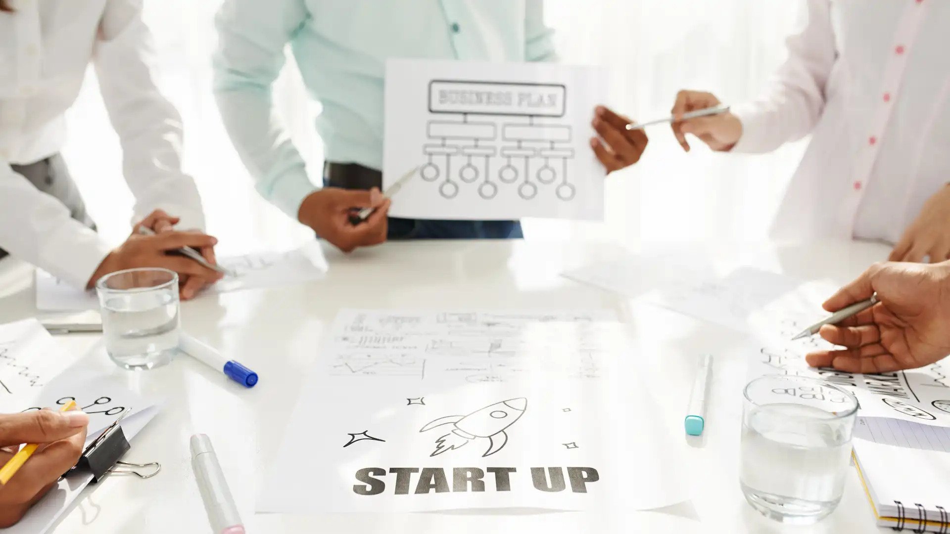 business team planning startup in bright office