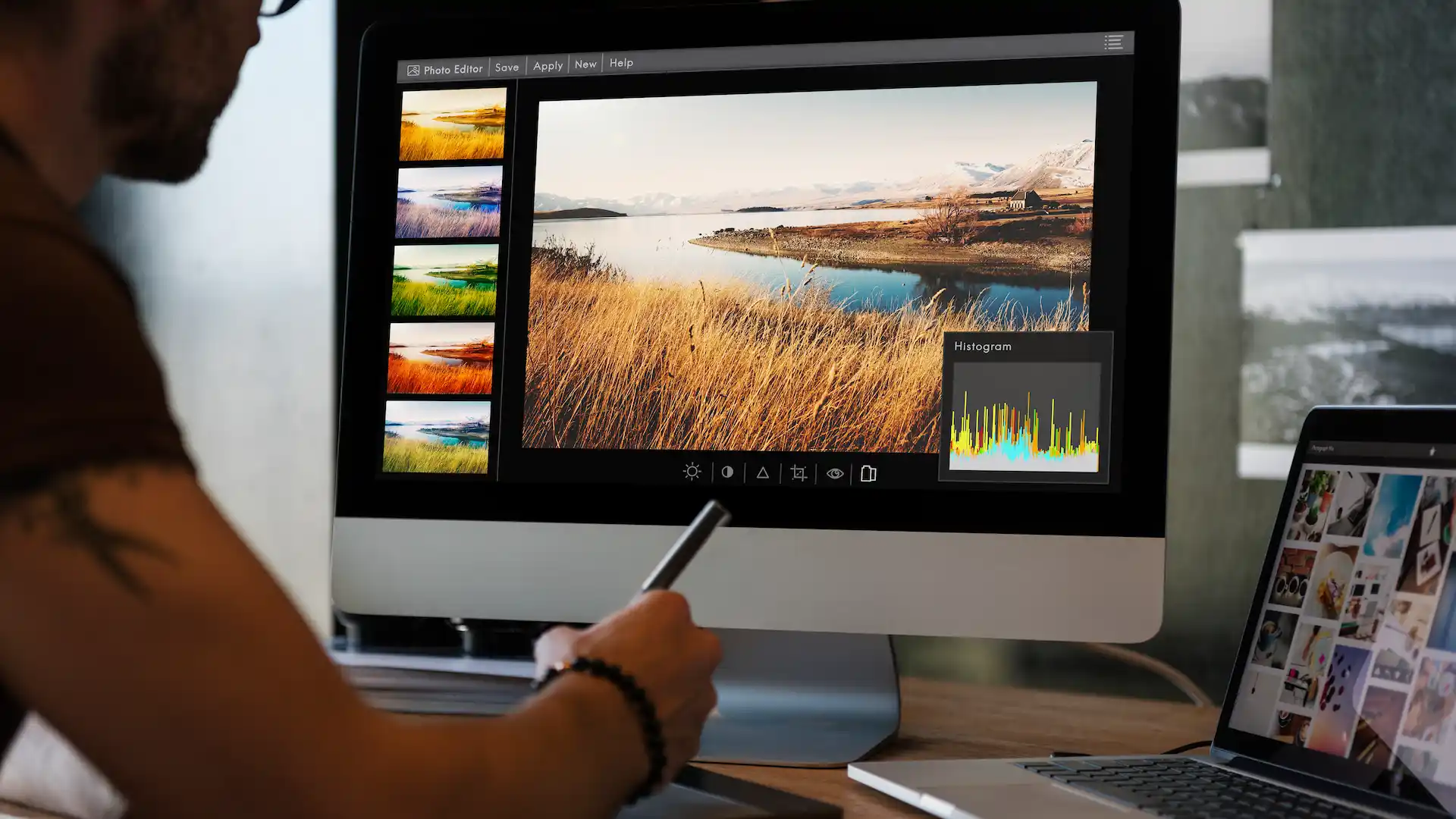 man editing landscape photo on desktop computer