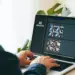person using laptop with generative ai on screen