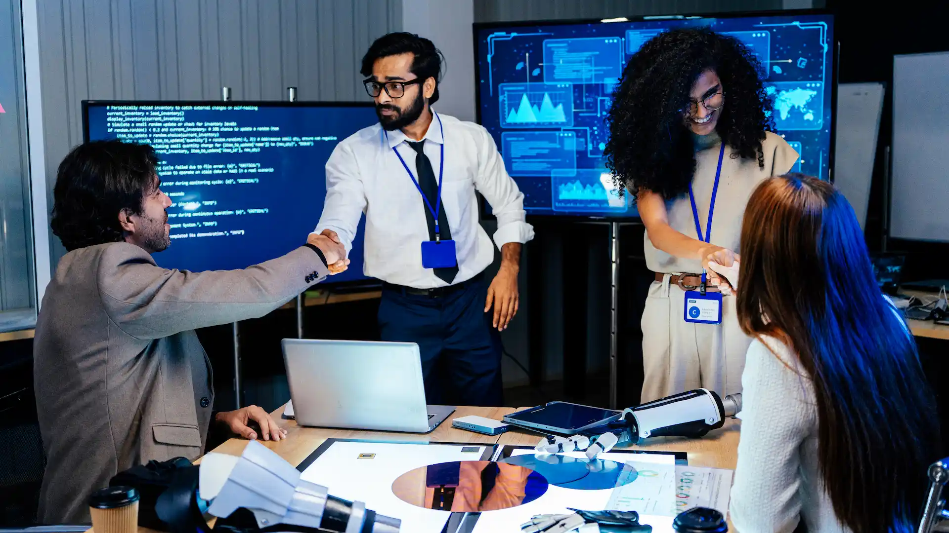professional tech team shaking hands in modern