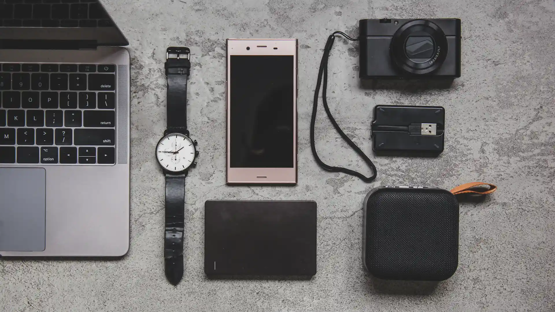 top view of laptop and mobile accessories