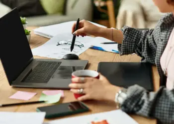 young adult working at home with graphics tablet