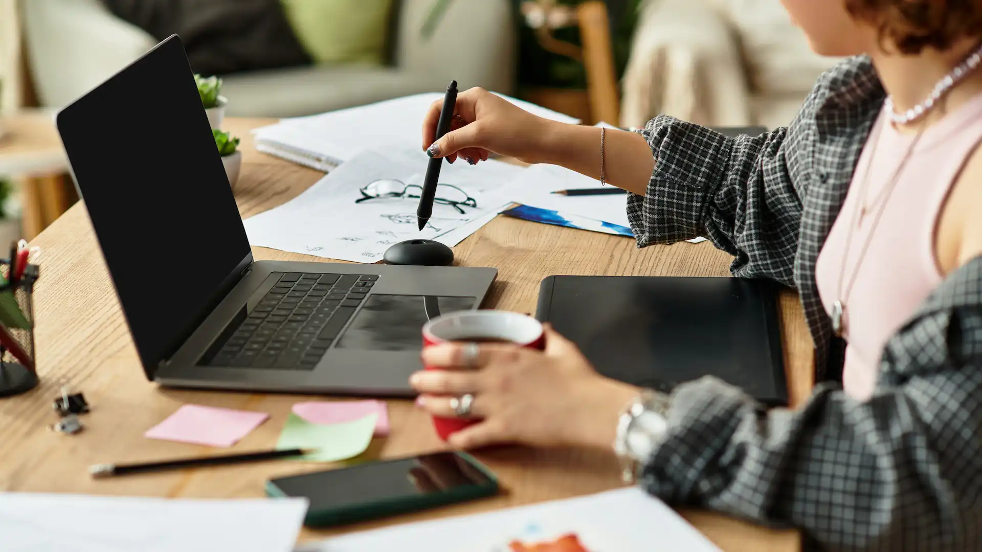 young adult working at home with graphics tablet